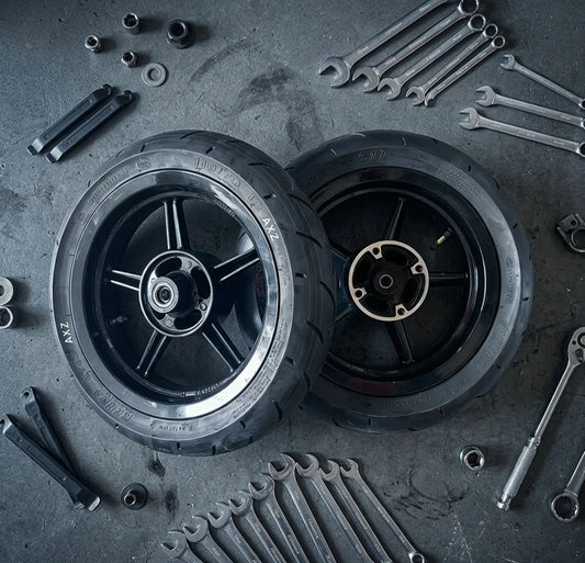 Projekt46 14-inch supermoto wheel and tire set on a workshop floor
